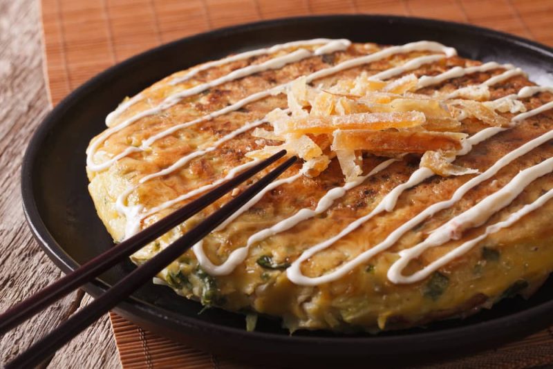 Okonomiyaki, a traditional japanese dish.